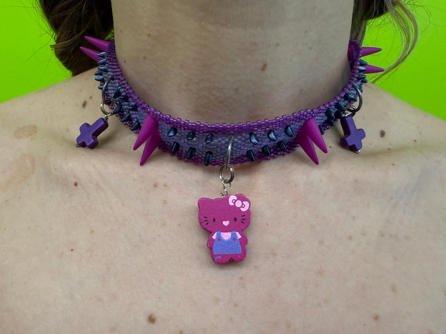 Daniela Mamon purple kitty cross beaded necklace