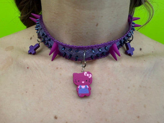 Daniela Mamon purple kitty cross beaded necklace