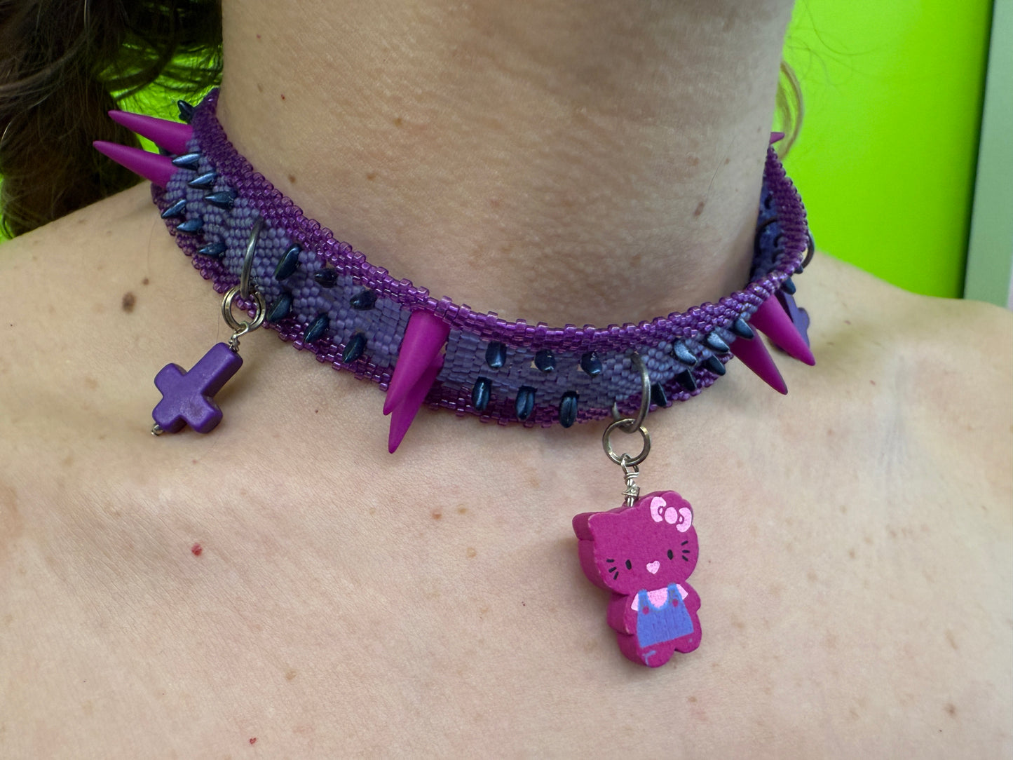 Daniela Mamon purple kitty cross beaded necklace